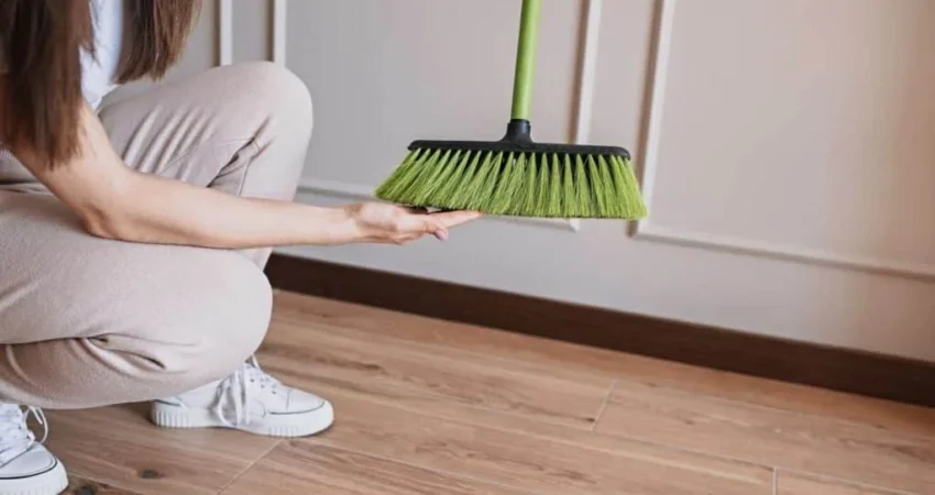 cleaning off broom